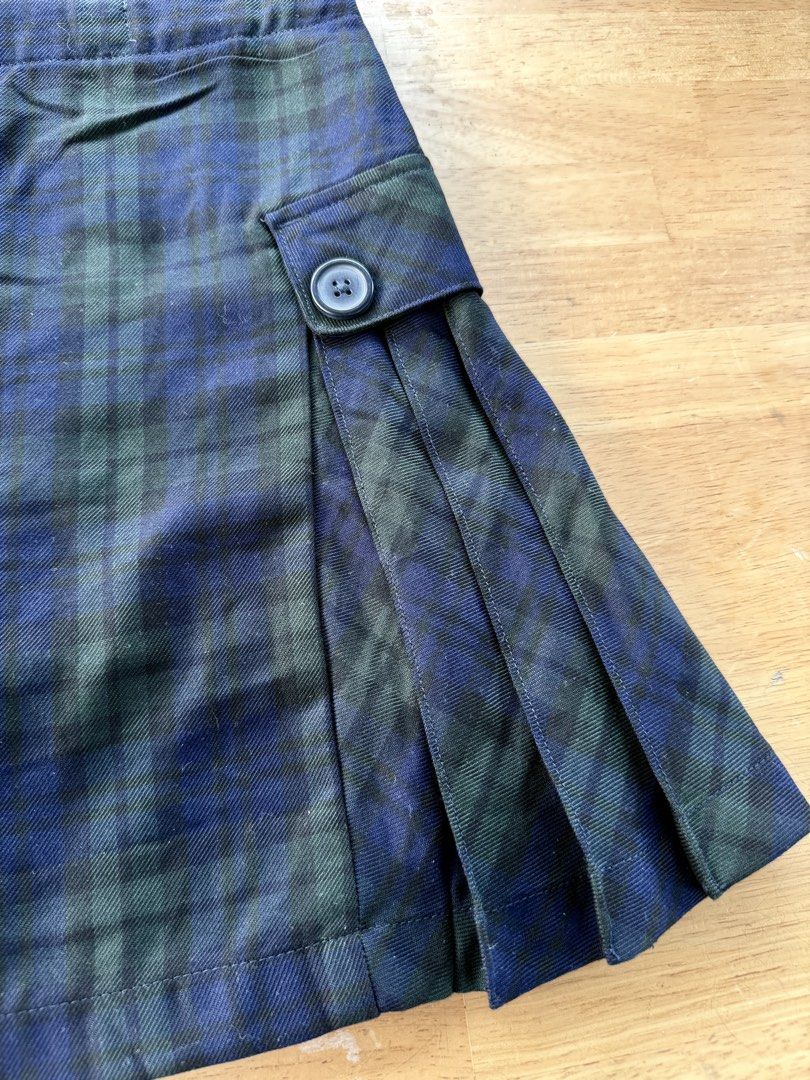 Blue and Green Plaid Skort with Pleats (Category: Skirts) located in Agdangan. Submitted by onahhhh (Listing ID 1469774026, Image 2). Description: - Style: Blue and green plaid skort with side pleats and front flap buttons - Comfort: Built-in black shorts underneath for extra coverage - Fit: Easy slip-on style with a stretchy elastic waistband in the back - Versatility: Perfect for pairing with your favorite casual tops.