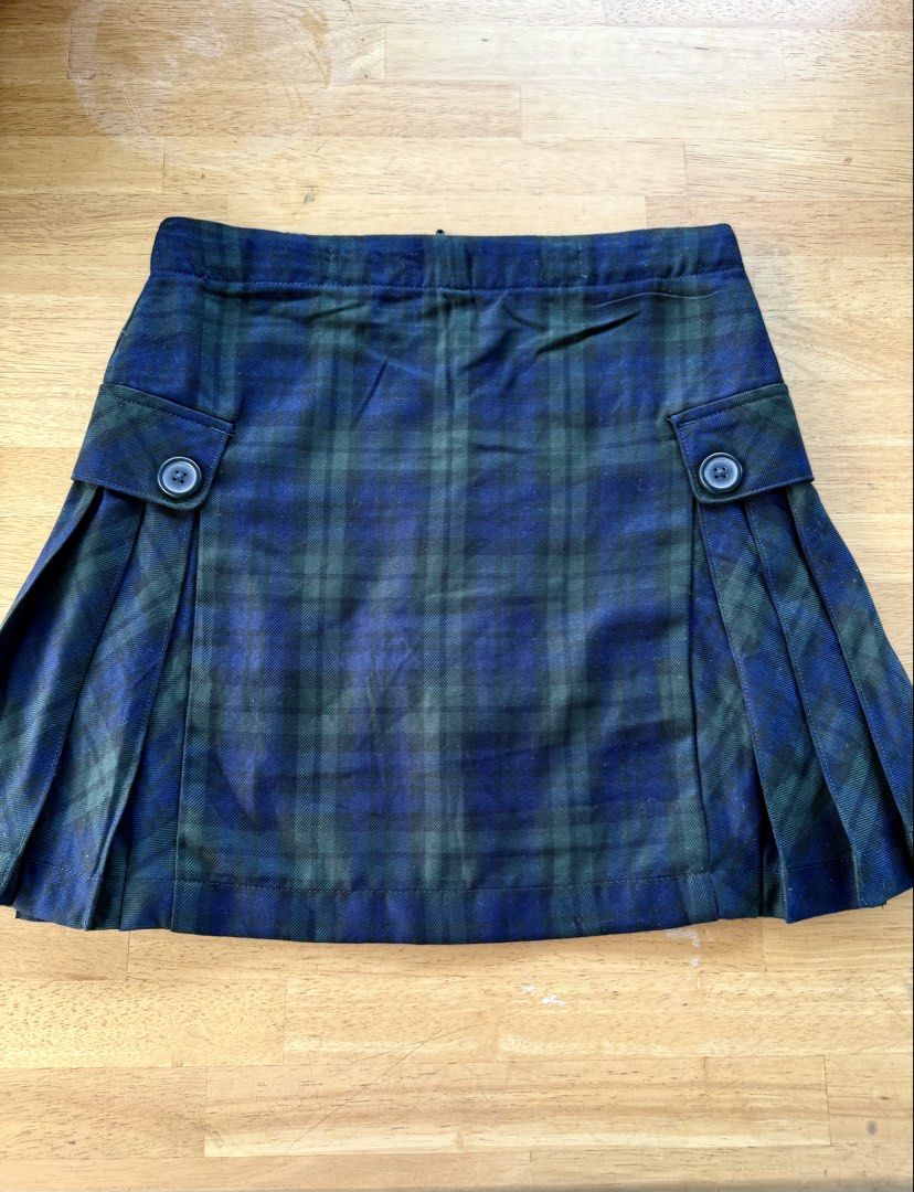 Blue and Green Plaid Skort with Pleats (Category: Skirts) located in Agdangan. Submitted by onahhhh (Listing ID 1469774026, Image 1). Description: - Style: Blue and green plaid skort with side pleats and front flap buttons - Comfort: Built-in black shorts underneath for extra coverage - Fit: Easy slip-on style with a stretchy elastic waistband in the back - Versatility: Perfect for pairing with your favorite casual tops.
