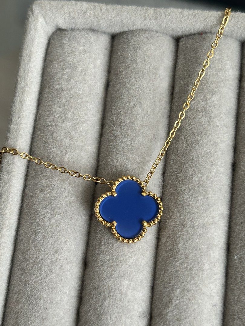 Blue Clover Necklace (Category: Necklaces) located in Manila. Submitted by elonlineshop (Listing ID 1469783615, Image 3). Description: - Style: Alhambra-inspired clover pendant with beaded border - Color: Gold chain with blue clover motif - Fit: Sits perfectly on the collarbone - Versatility: Great for daily wear or dressing up an outfit -Stainless Steel.