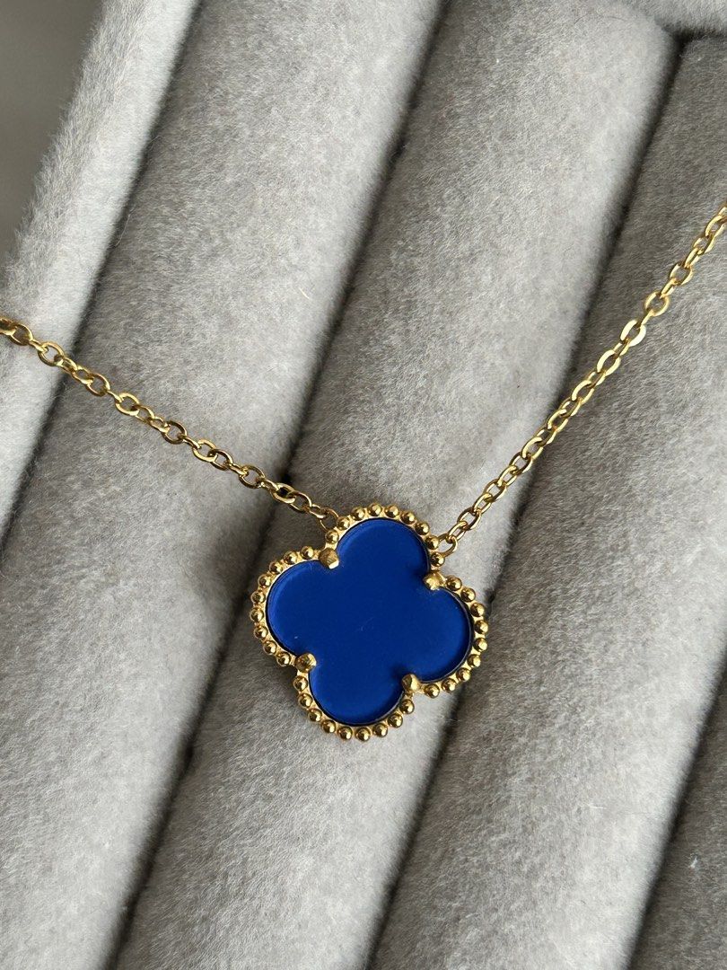 Blue Clover Necklace (Category: Necklaces) located in Manila. Submitted by elonlineshop (Listing ID 1469783615, Image 2). Description: - Style: Alhambra-inspired clover pendant with beaded border - Color: Gold chain with blue clover motif - Fit: Sits perfectly on the collarbone - Versatility: Great for daily wear or dressing up an outfit -Stainless Steel.