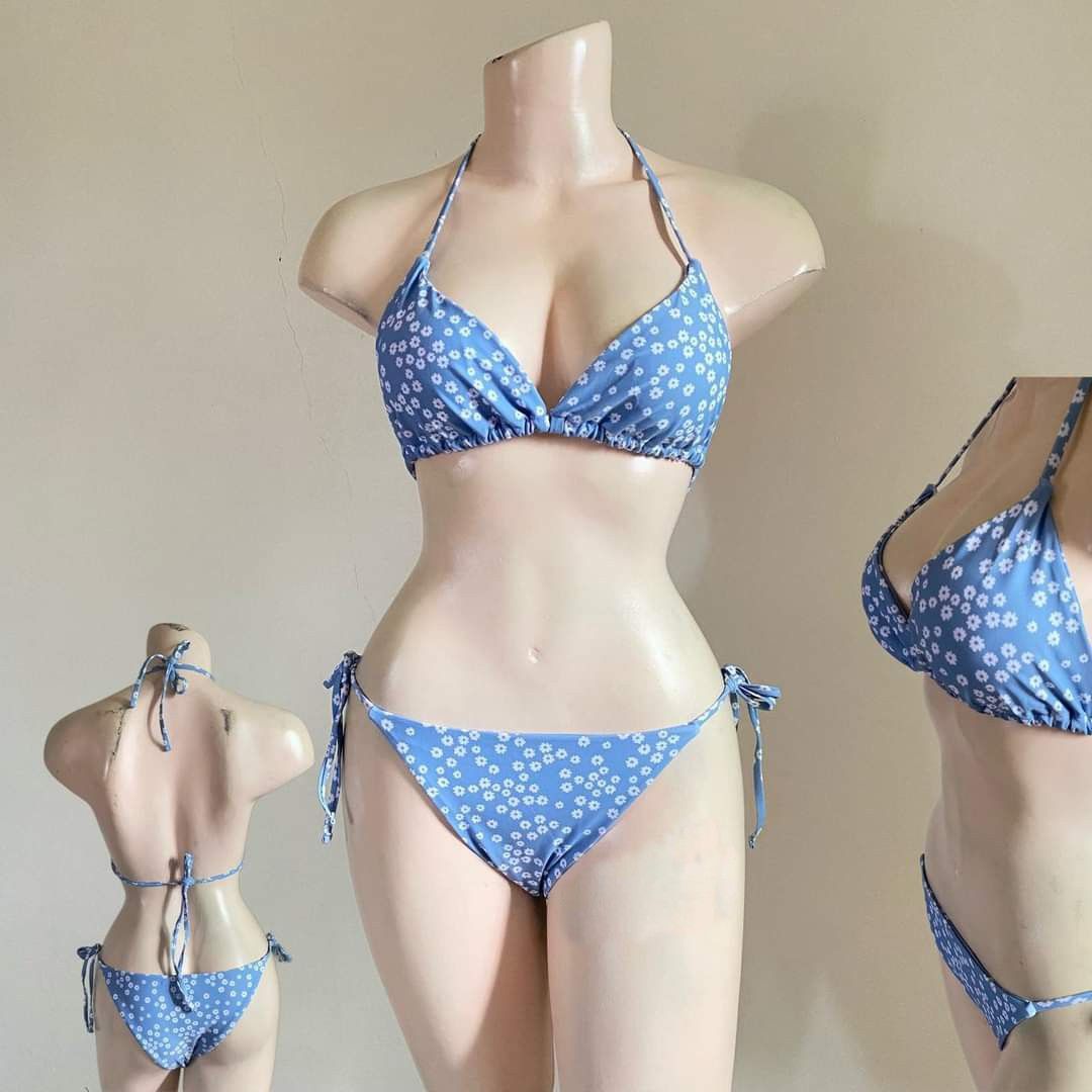 Blue Daisy Print Halter Bikini Set (Category: Bikinis & Swimsuits) located in Bacoor. Submitted by Miss_Chuch0521 (Listing ID 1469808718, Image 2). Description: - Style: Cute two-piece halter swimsuit - Size: Can fit L-XL (Self Tie) - Design: Blue with all-over white daisy floral pattern - Top: Halter neck with adjustable front and back string ties - Bottoms: Low-rise with adjustable side tie closures - Condition: Brand new / unworn (tags removed