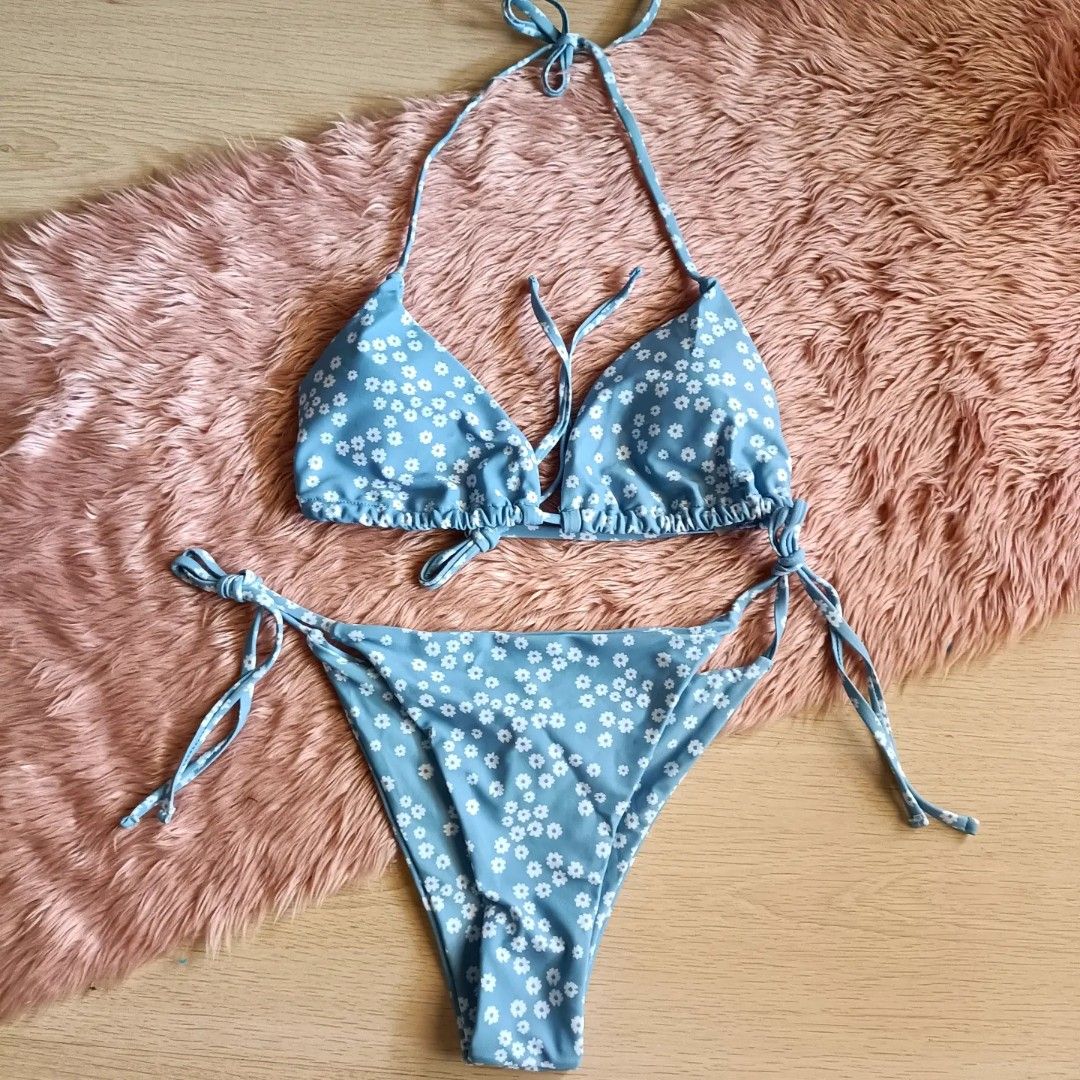 Blue Daisy Print Halter Bikini Set (Category: Bikinis & Swimsuits) located in Bacoor. Submitted by Miss_Chuch0521 (Listing ID 1469808718, Image 1). Description: - Style: Cute two-piece halter swimsuit - Size: Can fit L-XL (Self Tie) - Design: Blue with all-over white daisy floral pattern - Top: Halter neck with adjustable front and back string ties - Bottoms: Low-rise with adjustable side tie closures - Condition: Brand new / unworn (tags removed