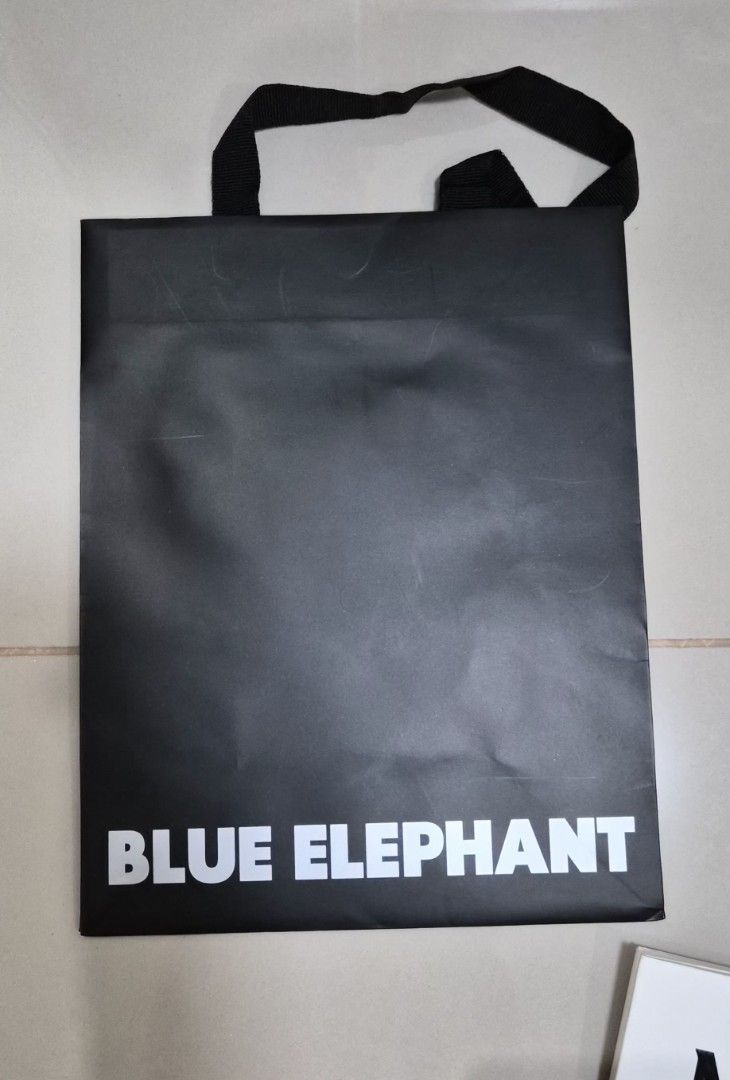 Blue Elephant Black Paper bag (Category: Everything Else Others) located in Paranaque City. Submitted by lovelife.312 (Listing ID 1469834608, Image 1). Description: ***PLEASE READ CAREFULLY*** - 1 piece Paper bag - decluttering room MAILING AND DELIVERY: - Meet up only SM City Sucat, Uptown Mall BGC and Ayala Malls by the Bay. - After lunch time 1pm onward. - If you prefer delivery, buyer will book courier and shoulder shipping fee. MOP: I will a