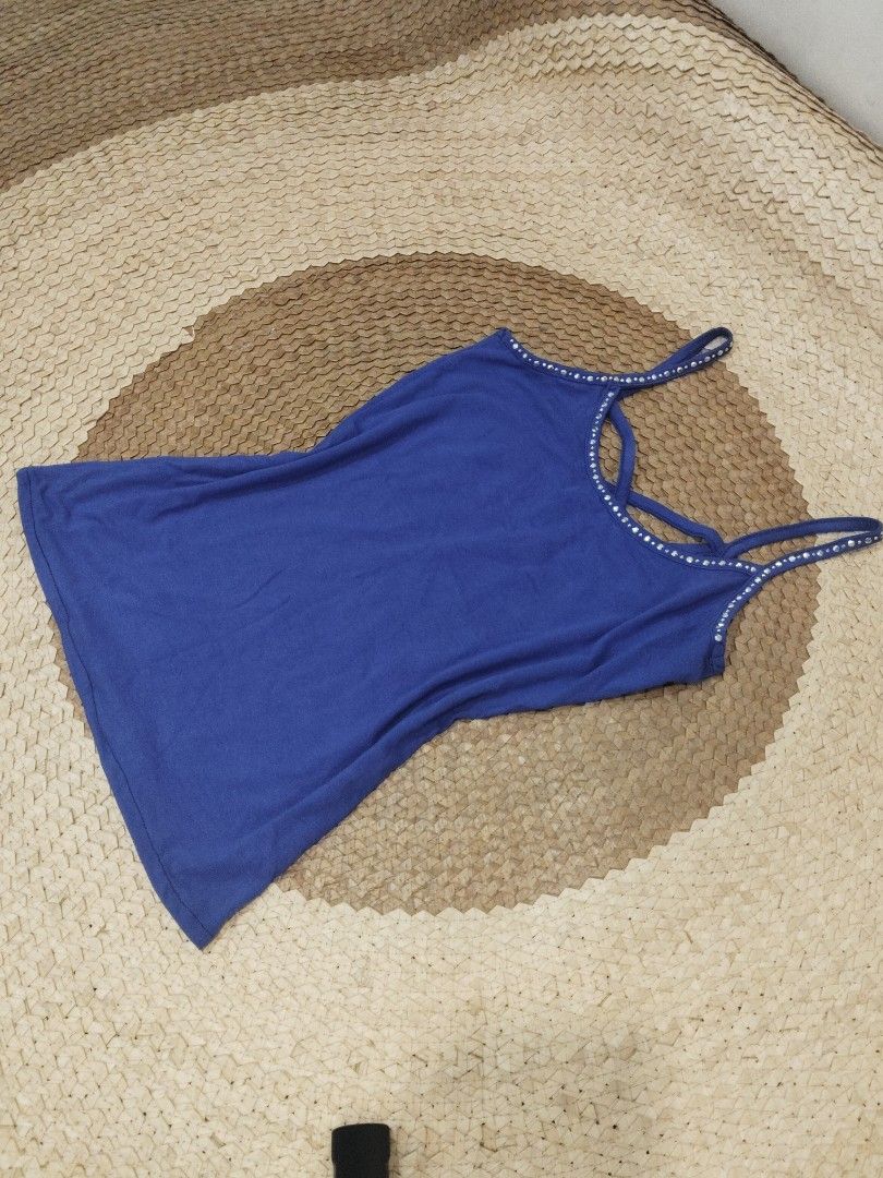 Blue Tank Top with Rhinestone Straps (Category: Sleeveless) located in San Juan City. Submitted by rhennx (Listing ID 1469868336, Image 1). Description: Small - Med - Color: Royal blue - Design: Sparkly rhinestone detailing on straps and neckline with a unique criss-cross front - Fabric: Soft and stretchy for a comfortable fit - Versatile: Great basic piece that easily styles with jeans or shorts - Condition: Brand new/Excellent.
