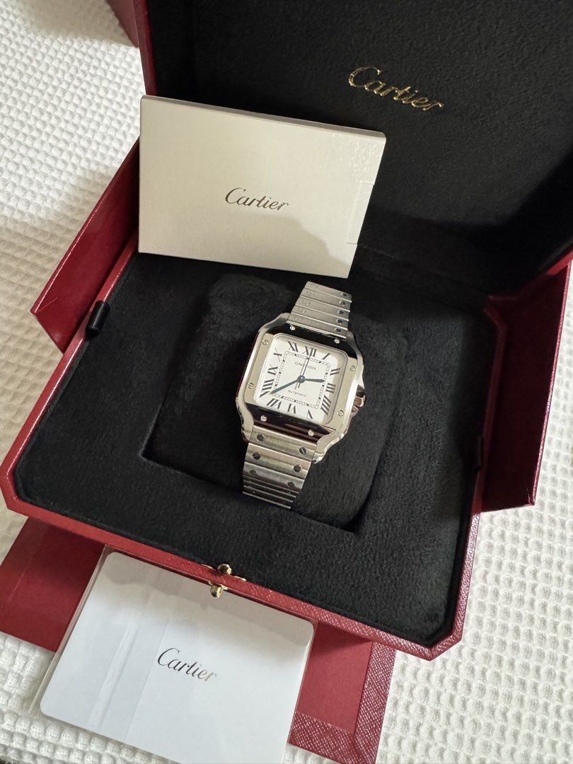 BNEW Cartier Santos Medium (Category: Luxury Watches) located in Manila. Submitted by atbp_seller (Listing ID 1469837892, Image 1). Description: BNEW Cartier Santos Automatic Watch - Size: Medium - Dial: Classic white with Roman numerals and signature blue sword hands - Includes: Original Cartier red presentation box and complete paperwork PHP 515,000.