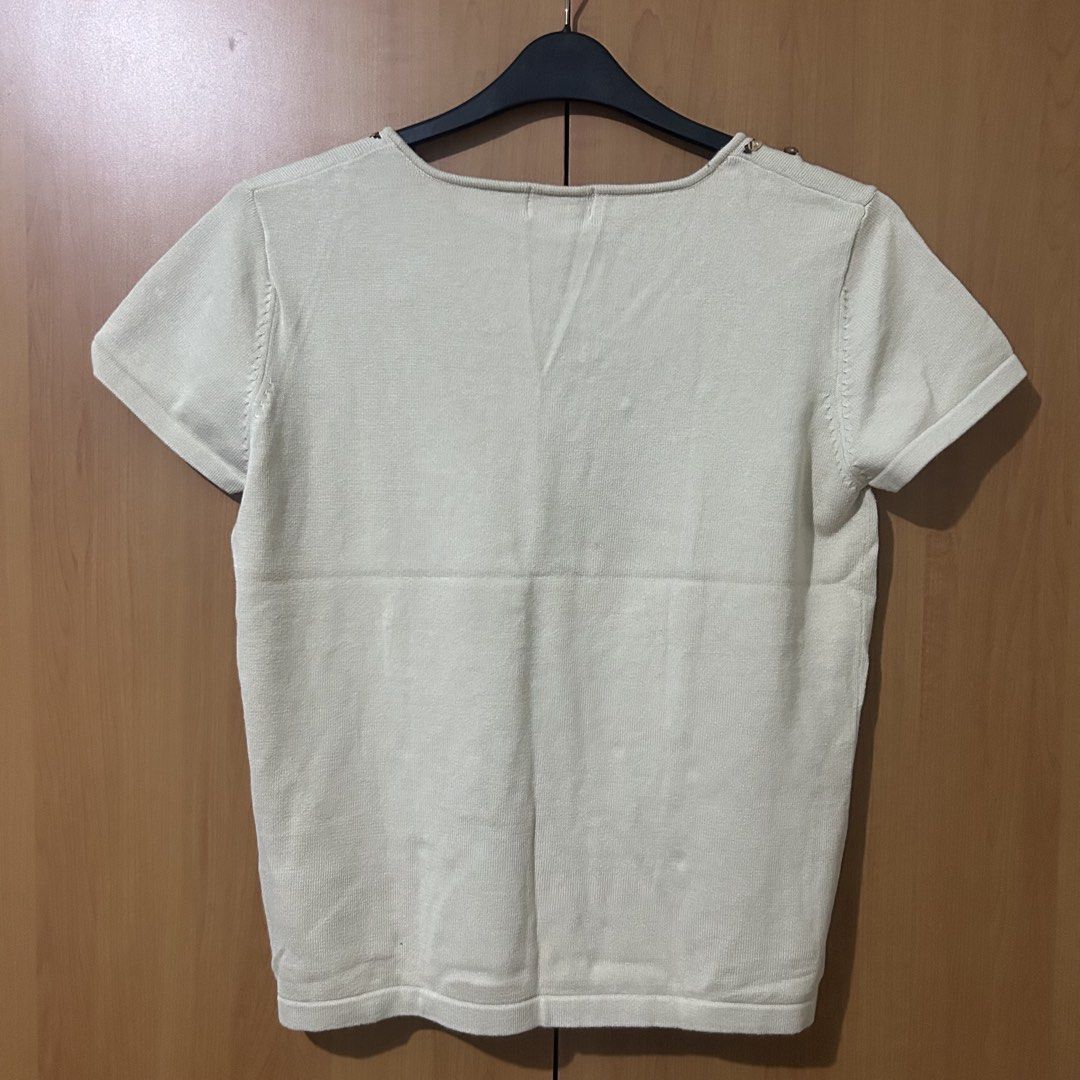 Boho Knit Top (Category: Blouses) located in Mandaluyong City. Submitted by vwonu (Listing ID 1469859074, Image 3). Description: - Brand: St. John's Bay - Size: Medium - Color: Beige / Cream - Material: Stretchy, comfortable cotton blend - Design: Short sleeve V-neck with faux suede lace-up tie, floral embroidery, and wooden bead accents - Back: Solid cream - Condition: Clean, tags intact inside the collar.
