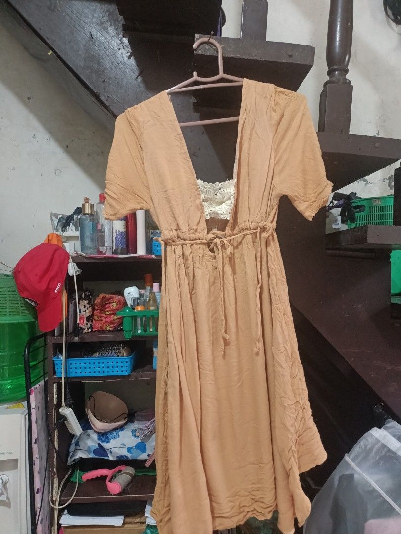 Boohoo's Caramel Dress (Category: Dresses) located in Manila. Submitted by clevertiger_069965 (Listing ID 1469793127, Image 2). Description: Cute brown boho-style dress with a beautiful cream crochet lace detail in the front, short puff sleeves, and a flattering cinched waist. Perfect for a soft, vintage-inspired and feminine look! • Color: Caramel Brown • Design: Crochet lace panel, cinched waist • Sleeves: Short puff sleeves • Style: Vintage / 