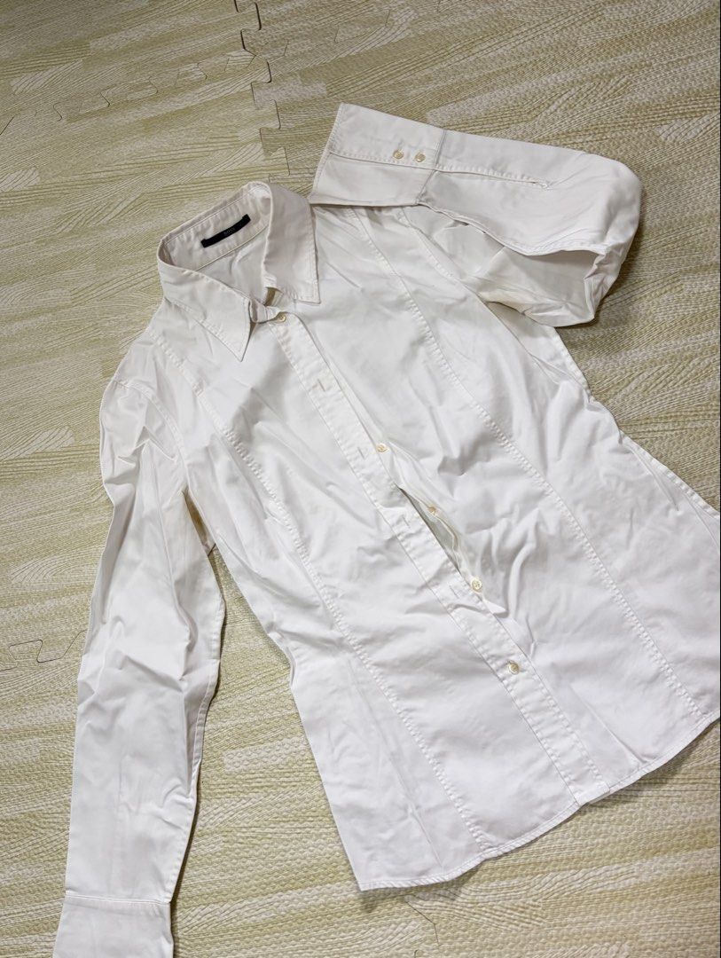 BOSS Hugo Boss White Button Up Shirt (Category: Tshirts & Polo Shirts ) located in Quezon City. Submitted by marifavo (Listing ID 1469820583, Image 1). Description: - Brand: BOSS Hugo Boss - Color: Solid white - Style: Classic button-up shirt with standard collar - Details: Clean neckline featuring the signature black brand tag inside the collar - Versatility: Ideal for work, business, or formal events - Condition: Clean and ready to wear.