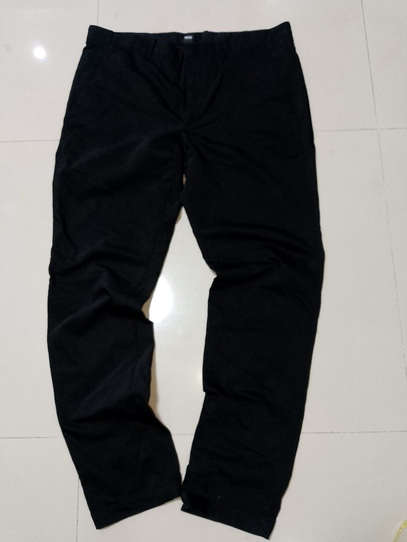 Boss Stretch Black Pants Size 36R (Category: Trousers) located in Manila. Submitted by mjthrifted_second (Listing ID 1469819643, Image 1). Description: - Brand: Boss - Color: Black - Size: US 36R / DE 52 Size: 37. Length 41 - Material: Stretch fabric for extra comfort - Fit: Classic straight cut - Details: Button and zip closure, functional back pockets - Condition: Clean, label intact.
