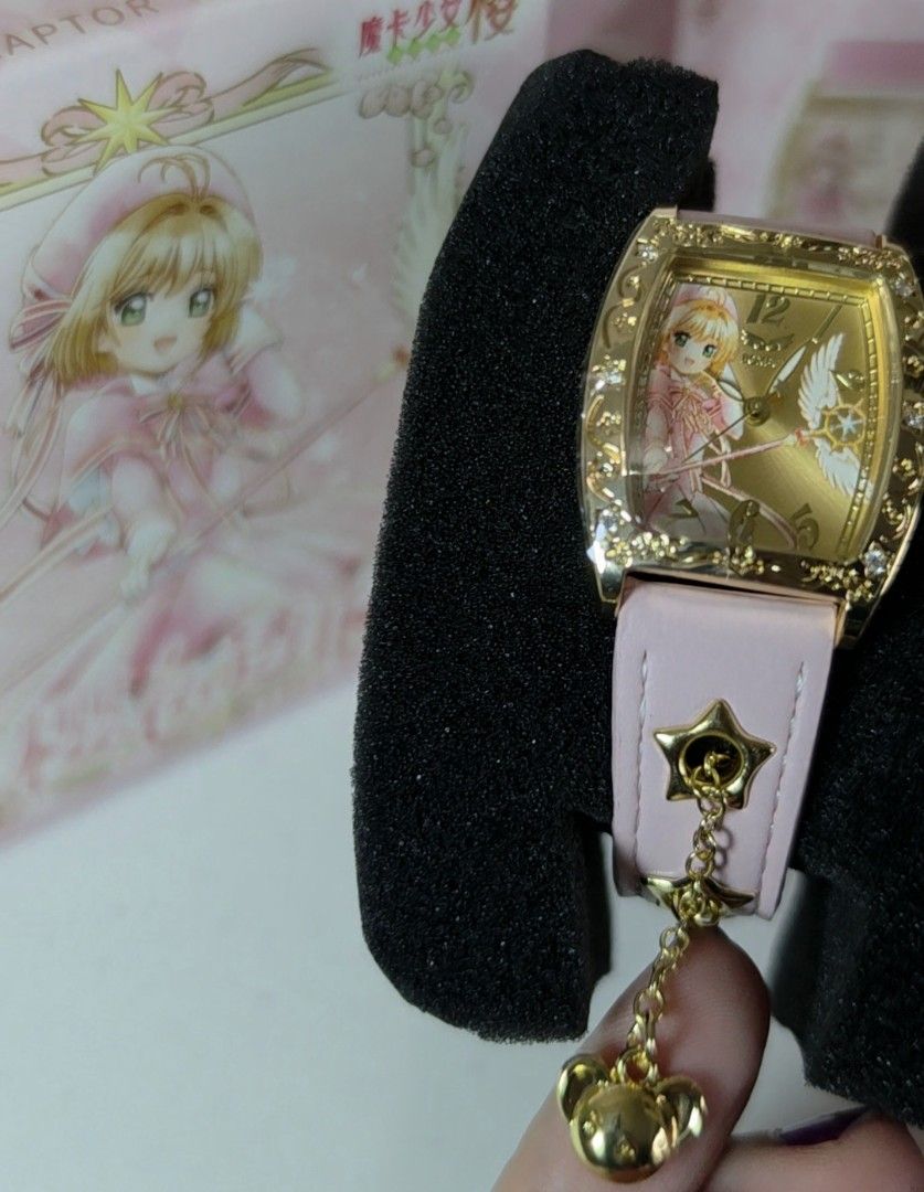 BOXFUN Cardcaptor Sakura Pink Watch (Category: Women's Watches) located in Pasig City. Submitted by ccsakura4 (Listing ID 1469913904, Image 1). Description: - Official Boxfun Cardcaptor Sakura character watch - Stunning gold-tone rectangular face featuring Sakura Kinomoto artwork - Pink leather strap with adjustable buckle and unique star-shaped eyelets - Includes a dangling star charm for extra magic - Reliable quartz movement - Comes complete w