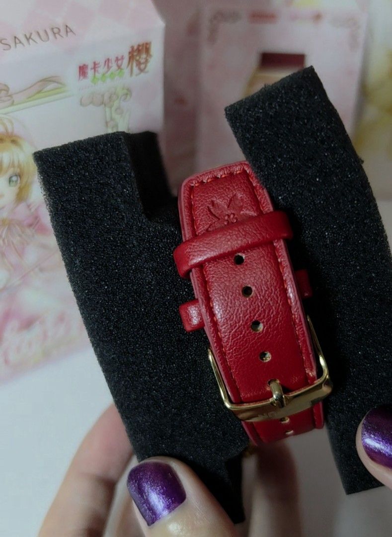 BOXFUN Cardcaptor Sakura Red Watch (Category: Women's Watches) located in Pasig City. Submitted by ccsakura4 (Listing ID 1469914309, Image 2). Description: - Official Kodansha merchandise by Boxfun - Style 03: Kinomoto Sakura design - Gold tone tonneau case with character artwork on the dial - Red leather strap featuring a cute dangling star charm - Includes original illustrated box and matching collectible card - Perfect for fans and collectors 