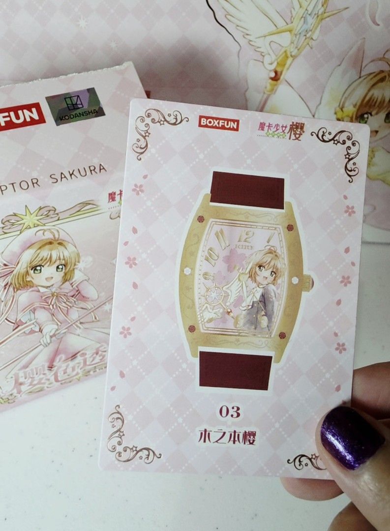 BOXFUN Cardcaptor Sakura Red Watch (Category: Women's Watches) located in Pasig City. Submitted by ccsakura4 (Listing ID 1469914309, Image 3). Description: - Official Kodansha merchandise by Boxfun - Style 03: Kinomoto Sakura design - Gold tone tonneau case with character artwork on the dial - Red leather strap featuring a cute dangling star charm - Includes original illustrated box and matching collectible card - Perfect for fans and collectors 