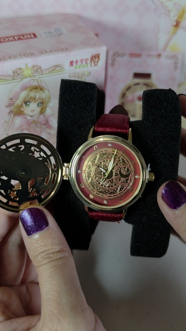 BOXFUN Cardcaptor Sakura Sealing Wand Watch (Category: Women's Watches) located in Pasig City. Submitted by ccsakura4 (Listing ID 1469914857, Image 2). Description: - Brand: Boxfun (Cardcaptor Sakura Model 06 Sealing Wand) - Design: Elegant gold-tone case with a detailed magic circle dial - Strap: Vibrant red strap complete with an attached themed charm - Inclusions: Comes with a matching collectible card and the original box - Ideal for: CCS fan