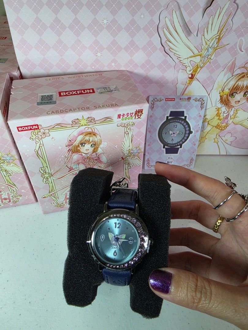 BOXFUN Cardcaptor Sakura Spinel Watch (Category: Women's Watches) located in Pasig City. Submitted by ccsakura4 (Listing ID 1469848056, Image 1). Description: - Authentic Boxfun Cardcaptor Sakura themed wristwatch - Dark blue leather strap - Light blue dial featuring Spinel in the center with sparkling crystals around the bezel - Brandnew. Box opened only to check the design since this is a random box..