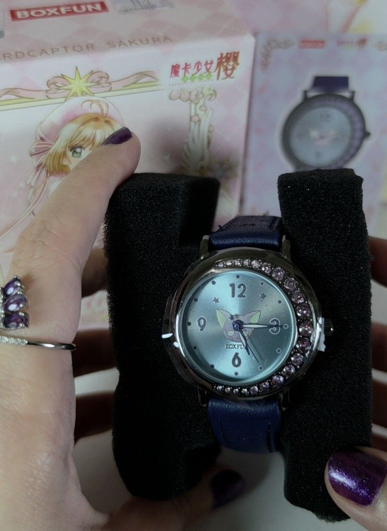 BOXFUN Cardcaptor Sakura Spinel Watch (Category: Women's Watches) located in Pasig City. Submitted by ccsakura4 (Listing ID 1469848056, Image 2). Description: - Authentic Boxfun Cardcaptor Sakura themed wristwatch - Dark blue leather strap - Light blue dial featuring Spinel in the center with sparkling crystals around the bezel - Brandnew. Box opened only to check the design since this is a random box..