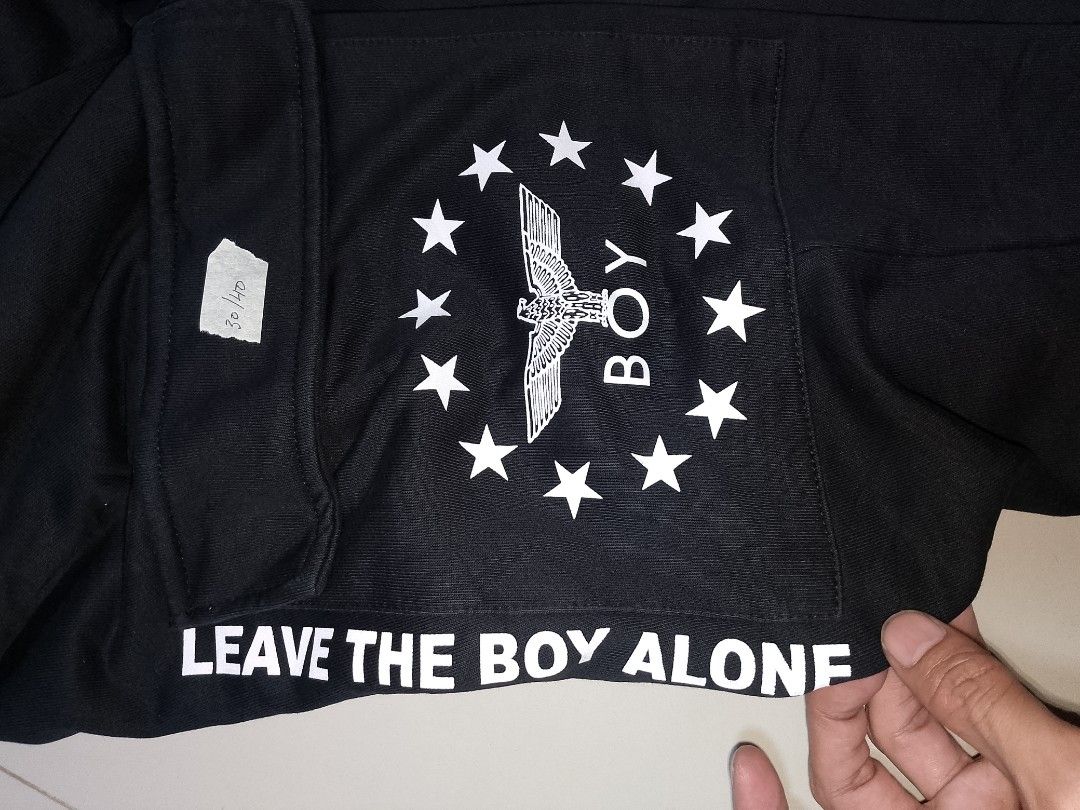 Boy London Black Cargo Sweatpants Joggers (Category: Joggers) located in Manila. Submitted by mjthrifted_second (Listing ID 1469833704, Image 3). Description: Code 10 - Brand: Boy London (Authentic) - Color: Black - Style: Sweatpants with cargo pockets, drawstring waist, and elastic cuffs - Details: Eagle logo and stars graphic on the right leg - Back Print: 'LEAVE THE BOY ALONE' text on the back leg - Condition: Branded drawstrings and interior 