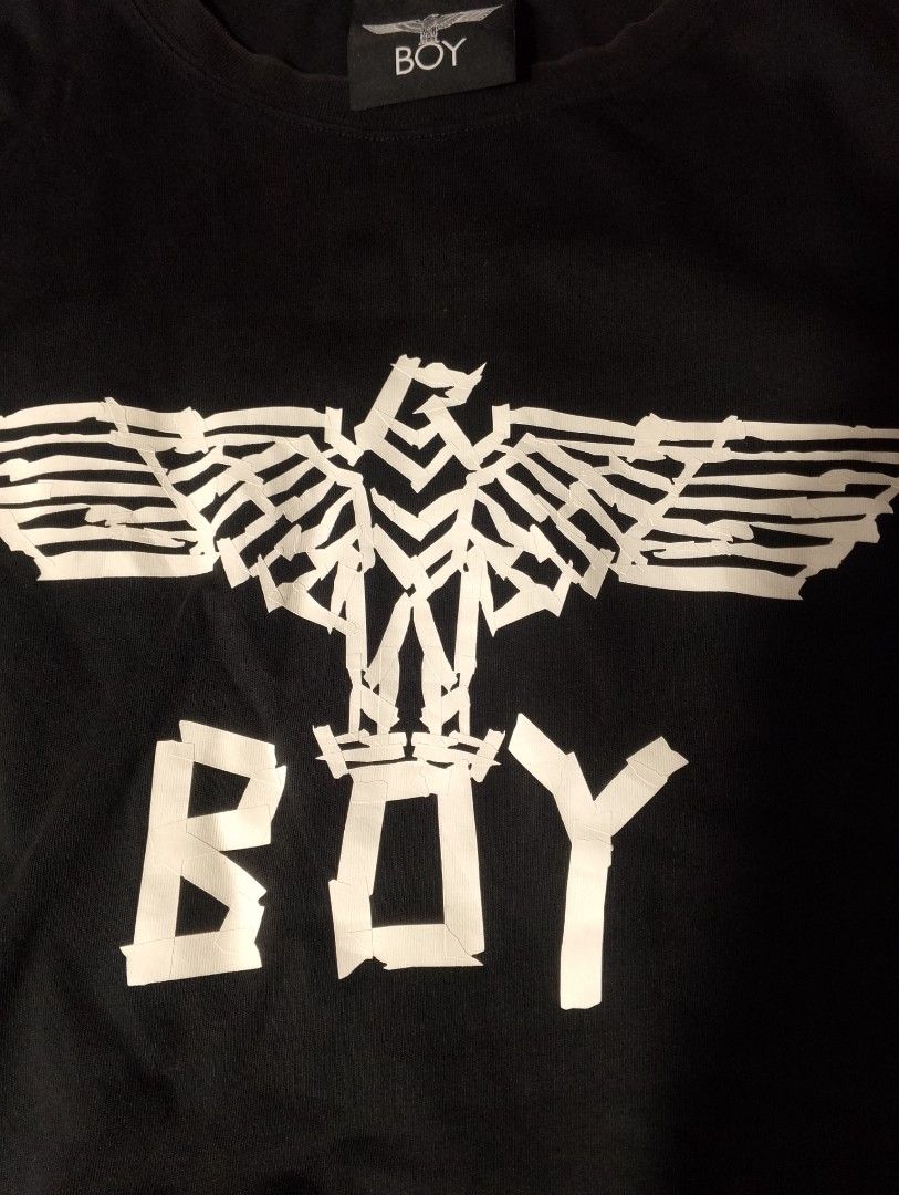 BOY London Black Eagle Graphic Tee Medium (Category: Tshirts & Polo Shirts ) located in Tanay. Submitted by _justdothrift (Listing ID 1469916823, Image 2). Description: - Brand: BOY London - Color: Black with white chest graphic - Size: Medium (tag attached) - Material: Soft and breathable cotton - Fit: Regular short sleeve cut - Condition: Clean, excellent overall condition with legible wash tags.
