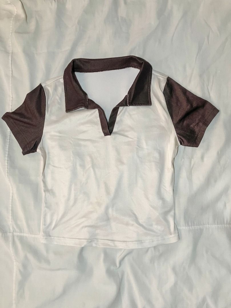 Brown and White Contrast Polo Crop Top (Category: Shirts) located in Bacoor. Submitted by maycee.rafallo (Listing ID 1469802834, Image 1). Description: - Style: Short sleeve polo crop top with open V-neck - Color: White body with contrast brown collar and sleeves - Material: Soft and stretchy - Fit: Easy to style with high-waisted jeans or skirts - Condition: Clean, no stains or damage found.