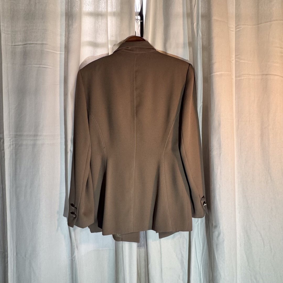 Brown Blazer - Babak (Category: Coats, Jackets and Outerwear) located in Marikina City. Submitted by repurpose_studio (Listing ID 1469782601, Image 2). Description: - Brand/Style: Babak Brown Blazer - Size: 38 - Closure: Unique geometric metal clasp with rhinestones - Sleeves: Long sleeves with decorative gem buttons on the cuffs - Details: Classic lapel collar, structured shoulders, and flattering front panel seaming - Interior: Fully lined Best