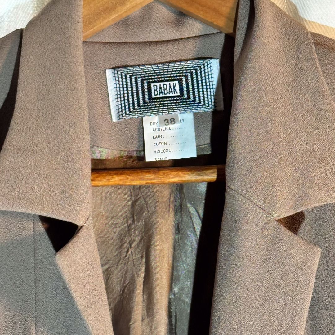 Brown Blazer - Babak (Category: Coats, Jackets and Outerwear) located in Marikina City. Submitted by repurpose_studio (Listing ID 1469782601, Image 3). Description: - Brand/Style: Babak Brown Blazer - Size: 38 - Closure: Unique geometric metal clasp with rhinestones - Sleeves: Long sleeves with decorative gem buttons on the cuffs - Details: Classic lapel collar, structured shoulders, and flattering front panel seaming - Interior: Fully lined Best