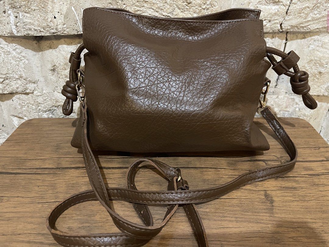brown faux-leather drawstring sling bag L8x11 (Category: Cross-body Bags) located in San Fernando. Submitted by japansurpluselyu (Listing ID 1469870524, Image 3). Description: .