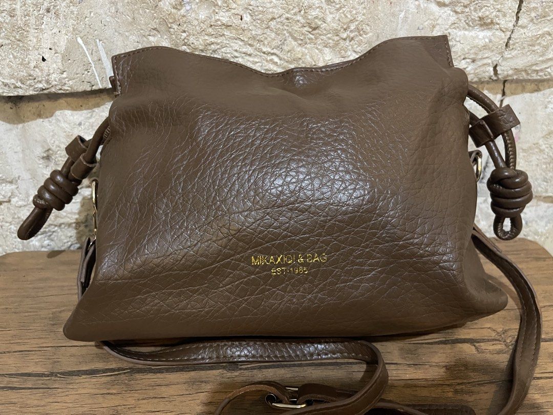 brown faux-leather drawstring sling bag L8x11 (Category: Cross-body Bags) located in San Fernando. Submitted by japansurpluselyu (Listing ID 1469870524, Image 2). Description: .