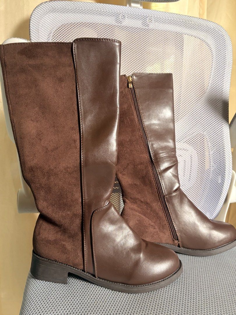 Brown Knee High Boots with Zipper (Category: Boots) located in Cavite. Submitted by thearchive.a (Listing ID 1469786313, Image 2). Description: - Style: Brown knee-high boots featuring a mix of smooth faux leather and soft suede panels - Convenience: Easy side zippers for quick wear - Comfort: Low stacked heels ideal for everyday use - Condition: Clean soles and well-maintained uppers - Season: Perfect for completing your cooler weather outfits.