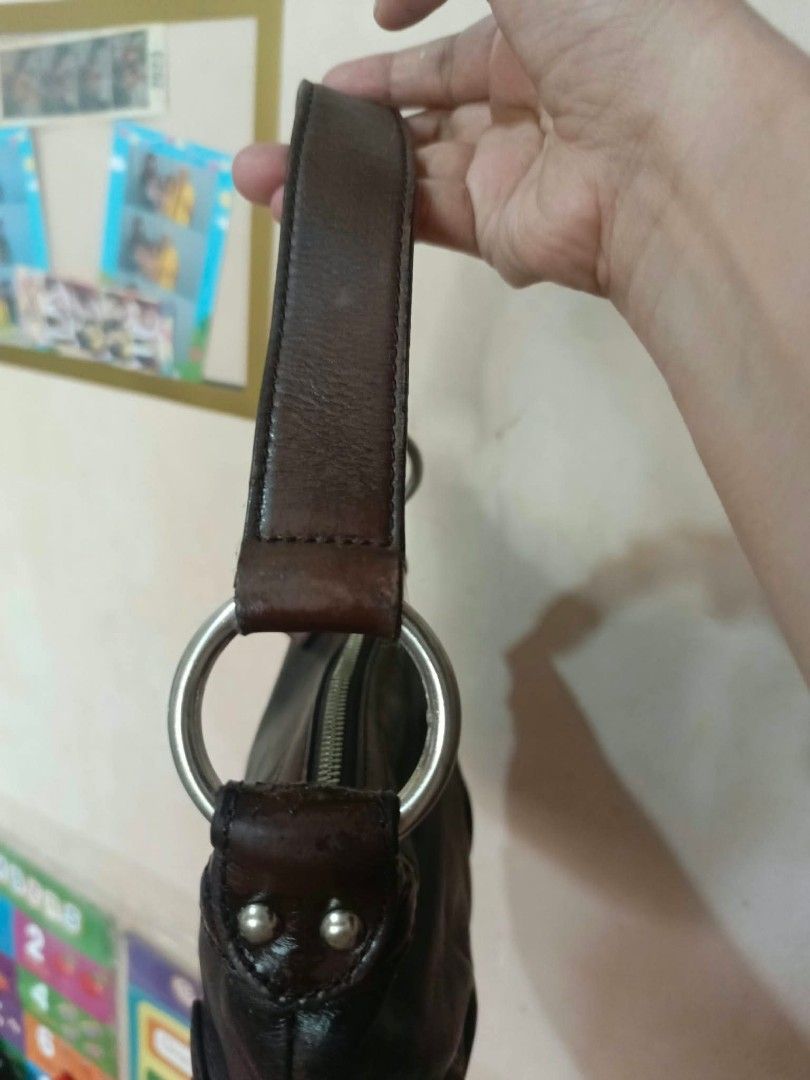 Brown Leather Shoulder Bag with Silver Hardware (Category: Shoulder Bags) located in Manila. Submitted by dei03_diz (Listing ID 1469799533, Image 2). Description: - Color: Dark brown - Material: structured leather with reinforced base corners - Closure: Top zipper with leather pull tab ykk zip - Hardware: Silver-tone rings and lobster clasp strap - Size: Compact, perfect for daily essentials.