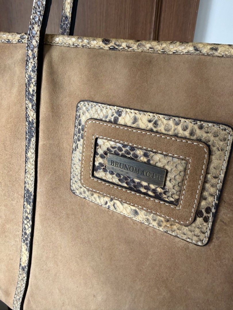Bruno Magli Tan Suede and Python Trim Tote Bag (Category: Luxury Bags & Wallets) located in Baguio. Submitted by p-finds (Listing ID 1469790750, Image 3). Description: - Brand: Bruno Magli (Made in Italy) - Material: Premium tan suede body with genuine python snakeskin trim - Hardware: Gold-tone metal brand plaque on the front - Straps: Comfortable dual shoulder straps - Interior: Signature monogram lining with a secure zip pocket - Condition: We