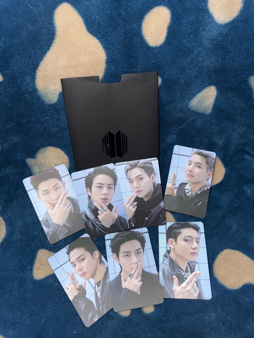BTS Proof Standard Edition Photocard Set OT7 (Category: K-Wave Merchandise) located in Manila. Submitted by jai.evnglsta (Listing ID 1469785613, Image 1). Description: - Complete OT7 photocard set from BTS Proof Standard Edition - Includes all 7 members: RM, Jin, Suga, J-Hope, Jimin, V, and Jungkook - Comes with the original black folder - Features members with rings against a white tiled background, with silver BTS logo on the back.
