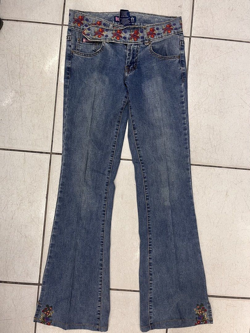 Bubblegum American Flavour Embroidered Bootcut Jeans (Category: Jeans) located in Dagupan City. Submitted by shanadongsb (Listing ID 1469864218, Image 1). Description: - Brand/Style: Bubblegum bootcut jeans in blue denim - Size: 3/4 - Design details: Red and blue floral embroidery on the waistband and bottom cuffs - Pockets: Two front pockets and two back pockets with stitched detailing - Material: 92% cotton, 8% spandex blend for a slight stretc