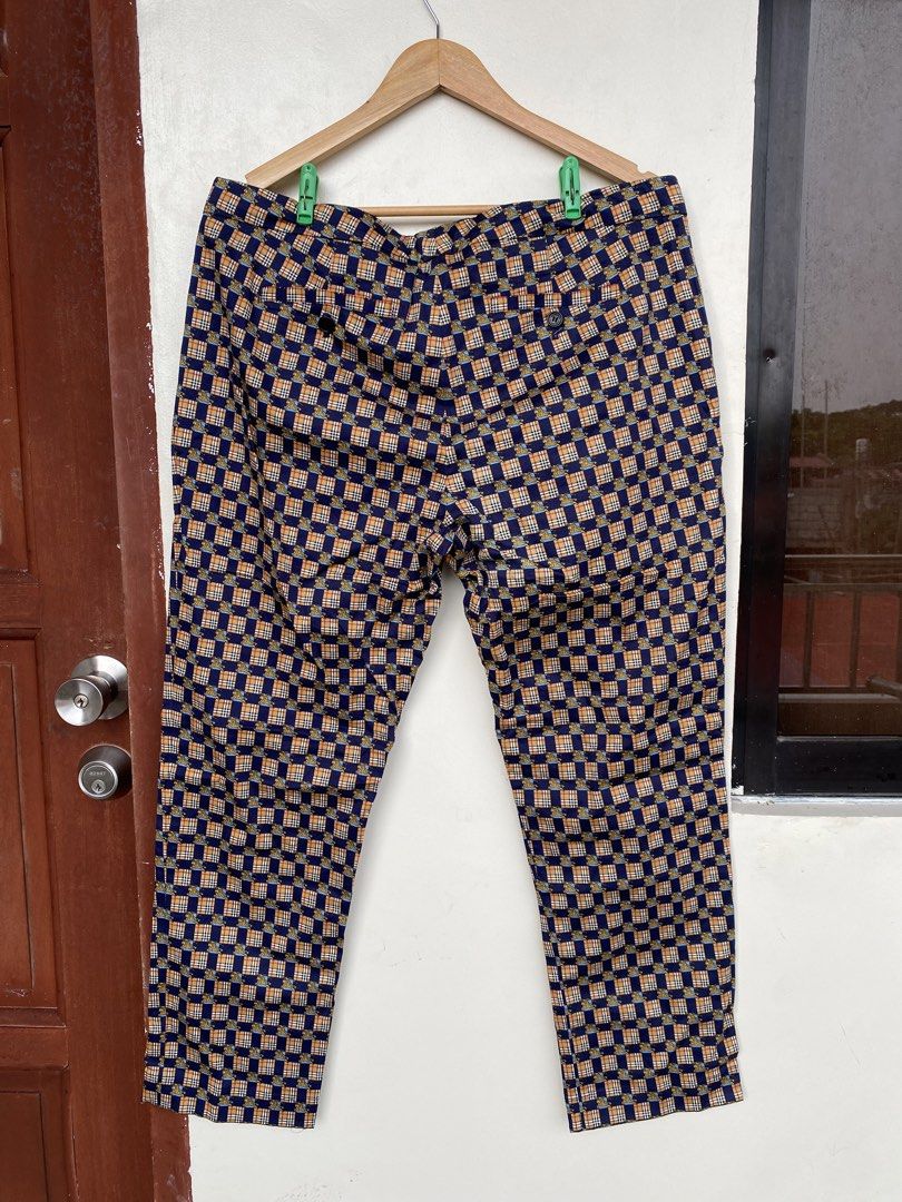 Burberry 2018 Equestrian Knight Check Trousers (Category: Luxury Apparel) located in Iloilo. Submitted by fukurou.vision (Listing ID 1469836632, Image 2). Description: Burberry 2018 Equestrian Knight Check Trousers Dimensions are in inches Waist - 37 Length - 36.5 Leg opening - 7.5 Buttons are Burberry Clasp is Burberry Cut tags These trousers originate from Burberry’s iconic late Christopher Bailey era, circa 2018, celebrating heritage house cod