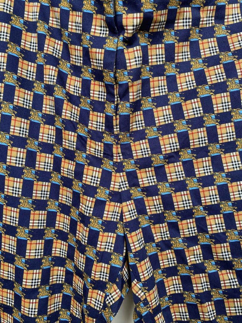 Burberry 2018 Equestrian Knight Check Trousers (Category: Luxury Apparel) located in Iloilo. Submitted by fukurou.vision (Listing ID 1469836632, Image 3). Description: Burberry 2018 Equestrian Knight Check Trousers Dimensions are in inches Waist - 37 Length - 36.5 Leg opening - 7.5 Buttons are Burberry Clasp is Burberry Cut tags These trousers originate from Burberry’s iconic late Christopher Bailey era, circa 2018, celebrating heritage house cod
