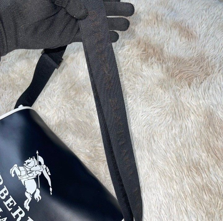 Burberry Black Label Messenger Bag (Category: Sling Bags) located in Dasmarinas. Submitted by classic.threads (Listing ID 1469782340, Image 2). Description: Burberry Black Label Messenger Bag Details: -Excellent Condition -Black -Big Logo in Front -Signs Of Usage - Embroid Burberry black label on strap -Adjustable Strap ΑΞ -2 big Pockets in front and back, 3 small inside pockets. -Leather -Slight Tattered on right inside. Size: *Flat Measurements