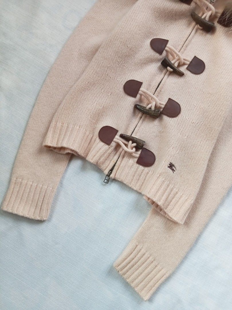 Burberry blue label toggle zip up knit jacket (Category: Luxury Apparel) located in Bagabag. Submitted by thrift_stories96 (Listing ID 1469883571, Image 3). Description: Burberry blue label toggle zip up knit jacket detachable hood Size 38 - medium frame Length - 22 Width - 17 stretch up to 18 Cloth material - knit stretchy Condition - excellent No flaw.