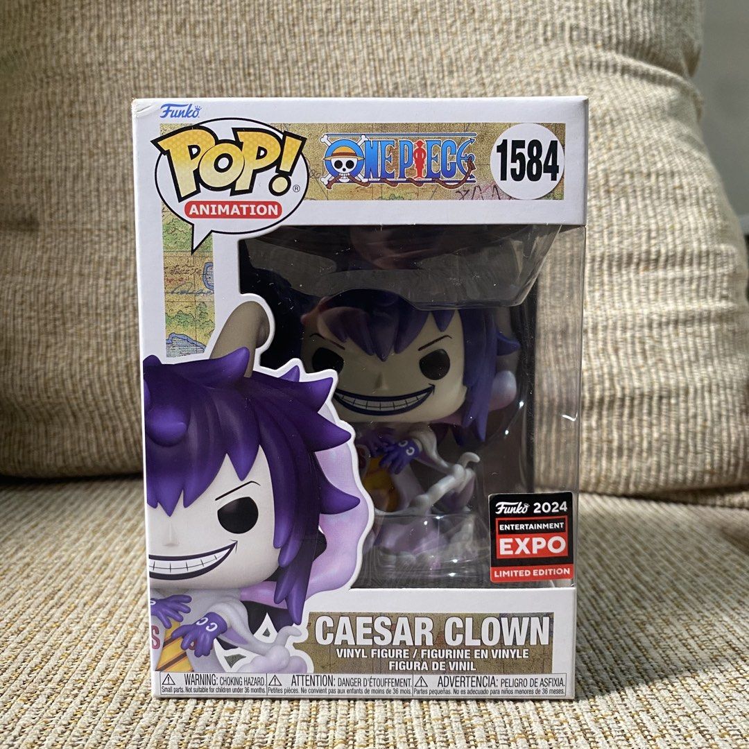 Caesar Clown Funko Pop (Category: Figurines & Statues) located in Paranaque City. Submitted by ddaveduave01162 (Listing ID 1469901685, Image 1). Description: - Character: Caesar Clown (#1584) from One Piece - Exclusive: 2024 Entertainment Expo Limited Edition sticker - Design: Purple hair, horns, and classic smiling expression - Perfect for One Piece fans and Funko collectors 8/10 Box Condition with crease Parañaque loc.