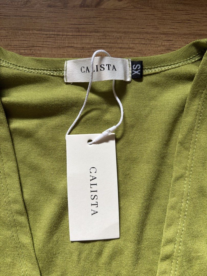 Calista Cardigan Longsleeves (Category: Longsleeves) located in San Pedro. Submitted by nikkiabc.777 (Listing ID 1469762843, Image 2). Description: Calista Core Cardigan Top Size: xs; can fit xs to s Fabric: soft cotton ribbed; semi stretched Brandnew; with tag and pouch Buttons are working Color: apple green.