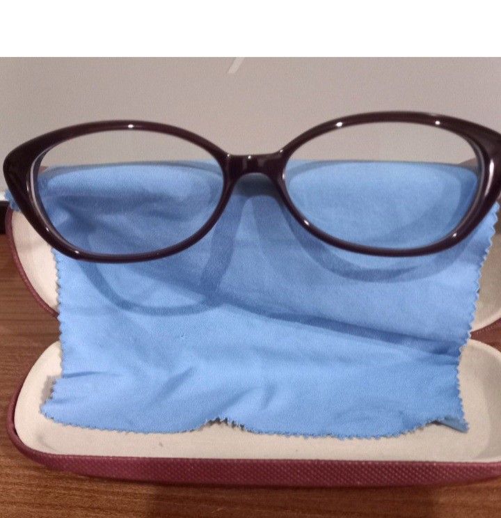 Calvin Klein Eyeglasses Dark Red Frames (Category: Sunglasses & Eyewear) located in Manila. Submitted by miss66449 (Listing ID 1469873605, Image 2). Description: - Brand: Calvin Klein - Style: Trendy round cat-eye - Color: Dark purple front with bright red temple arms - Lenses: Demo lenses, ready for your own prescription - Inclusions: Includes matching storage case and cleaning cloth - Condition: Great for everyday wear.