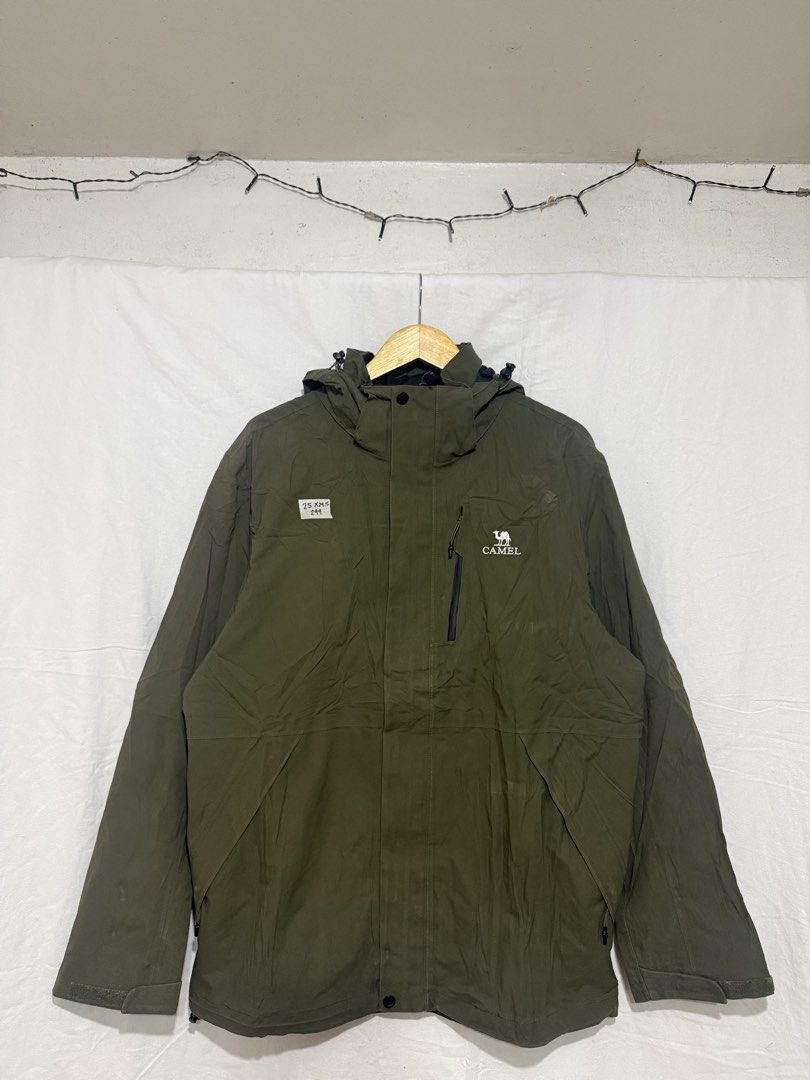 Camel Olive Green Waterproof Hooded Jacket (Category: Coats, Jackets and Outerwear) located in Quezon City. Submitted by dapanaaaay (Listing ID 1469927386, Image 1). Description: - Brand: Camel - Color: Olive green - Closure: Full zip front with snap-secured storm flap - Pockets: 1 zipped chest pocket (left side) and lower side pockets - Hood: Attached with adjustable drawstrings - Cuffs: Adjustable with velcro closures - Weather suitability: Ide