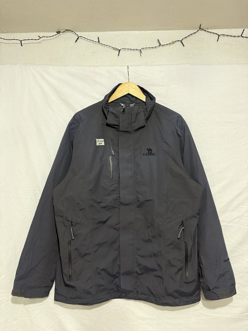 Camel Outdoor Waterproof Hiking Jacket Grey (Category: Coats, Jackets and Outerwear) located in Quezon City. Submitted by dapanaaaay (Listing ID 1469927554, Image 1). Description: - Brand/Style: Dark grey Camel outdoor jacket - Pockets: Multiple functional zip pockets on the front and chest - Hood & Collar: High collar design with an adjustable hood area - Cuffs: Adjustable Velcro straps for a snug, secure fit - Details: Embroidered Camel logo on