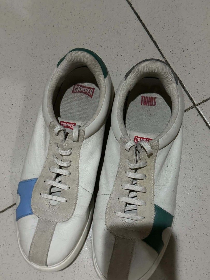 Camper Twins White Leather Sneakers Size 45 (Category: Casual Shoes) located in Manila. Submitted by morcillojo44726 (Listing ID 1469932595, Image 3). Description: Camper Twins leather sneakers in white with multi-color suede panels. Asymmetrical design with blue and green accents. Size 45 printed on the rubber sole. Wavy tread pattern underneath. Casual everyday shoes with classic Camper branding on the insoles..
