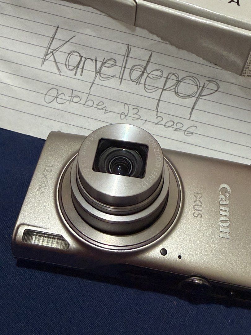 Canon IXUS 285 HS A Digital Camera with Box (Category: Cameras) located in Angeles City. Submitted by karyeldepop (Listing ID 1469923294, Image 3). Description: - Model: Canon IXUS 285 HS Digital Camera - Color: silver - Resolution & Zoom: 20.2 Megapixels with 12x Optical Zoom - Connectivity: has built-in Wi-Fi so can easily transfer photos to phone via app. Can also use connect camera to phone to check angles - Condition: 100% fully functional. 