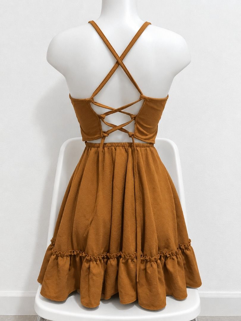Caramel Brown Cami Mini Dress with Ruffle Hem (Category: Dresses) located in San Jose. Submitted by lerwomensthrift (Listing ID 1469897678, Image 2). Description: Super cute caramel brown mini dress with adjustable spaghetti straps, a v-neck, and an open back with lace-up ties. Features a fitted bodice, elastic back waist, and a flared, ruffled skirt. Lightweight and perfect for sunny days!.