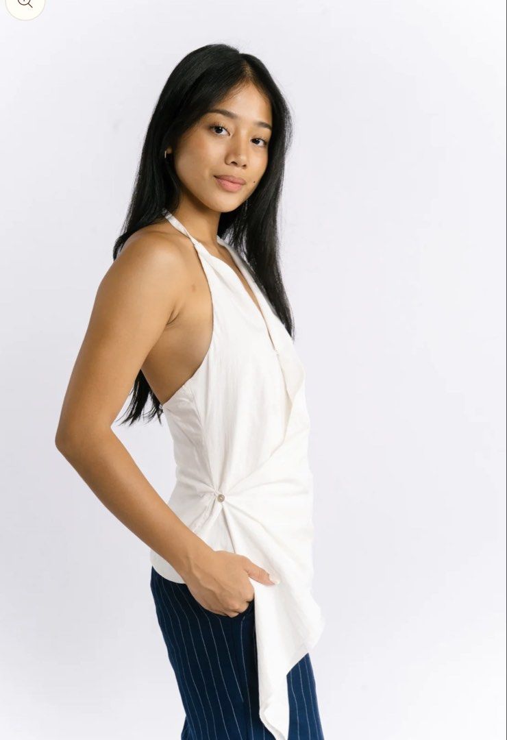 Cariño Backless Halter Top (Category: Sleeveless) located in Quezon City. Submitted by hanas.declutter (Listing ID 1469805063, Image 2). Description: - Cariño Silvia Top in white (sold out color) - might keep plz no lowballs - no when worn; kindly refer to their instagram instead (@_carino) .