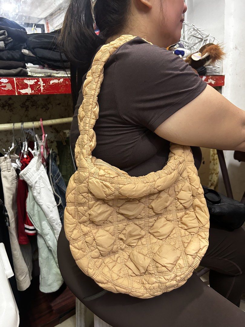 Carlyn Quilted Puffer Shoulder Bag Beige (Category: Shoulder Bags) located in Cebu City. Submitted by yenetcuba52435 (Listing ID 1469777832, Image 1). Description: - Authentic Carlyn quilted puffer shoulder bag in a versatile beige shade - Super soft, lightweight, and puffy texture with stylish grid stitching - Secure top zipper closure featuring a branded metal Carlyn pull tag - Features official Carlyn brand and care labels inside - Perfect cas