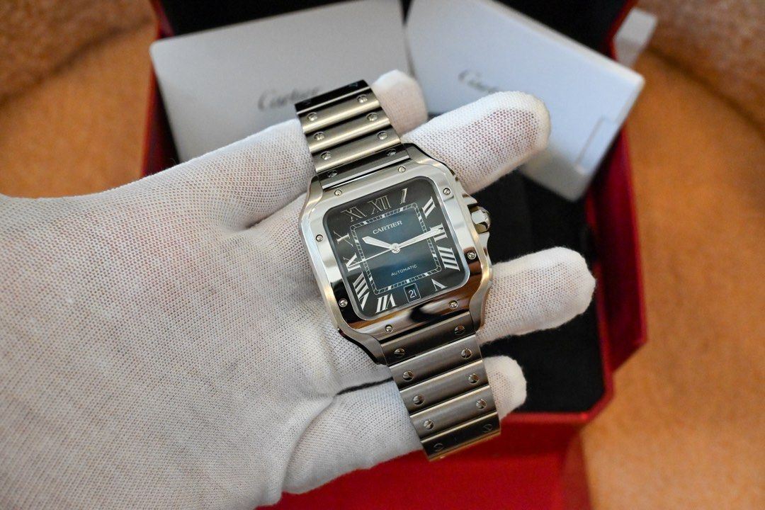 CARTIER SANTOS — LARGE BLUE DIAL (Category: Luxury Watches) located in Santa Rosa. Submitted by fourthhourtimepieces (Listing ID 1469785358, Image 1). Description: CARTIER SANTOS DE CARTIER — LARGE BLUE DIAL The signature Santos design with a graduated blue dial and stainless-steel bracelet. • Year: 2025 • Large — 39.8mm case width • Automatic movement • Blue Roman-numeral dial • Stainless-steel case and bracelet • Sapphire crystal • Date display