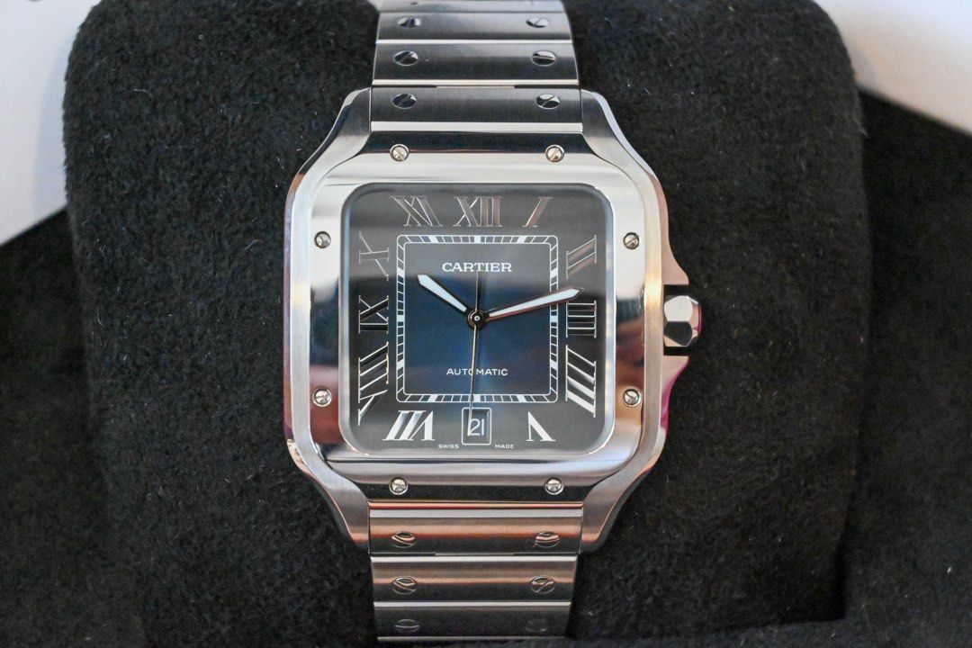 CARTIER SANTOS — LARGE BLUE DIAL (Category: Luxury Watches) located in Santa Rosa. Submitted by fourthhourtimepieces (Listing ID 1469785358, Image 2). Description: CARTIER SANTOS DE CARTIER — LARGE BLUE DIAL The signature Santos design with a graduated blue dial and stainless-steel bracelet. • Year: 2025 • Large — 39.8mm case width • Automatic movement • Blue Roman-numeral dial • Stainless-steel case and bracelet • Sapphire crystal • Date display