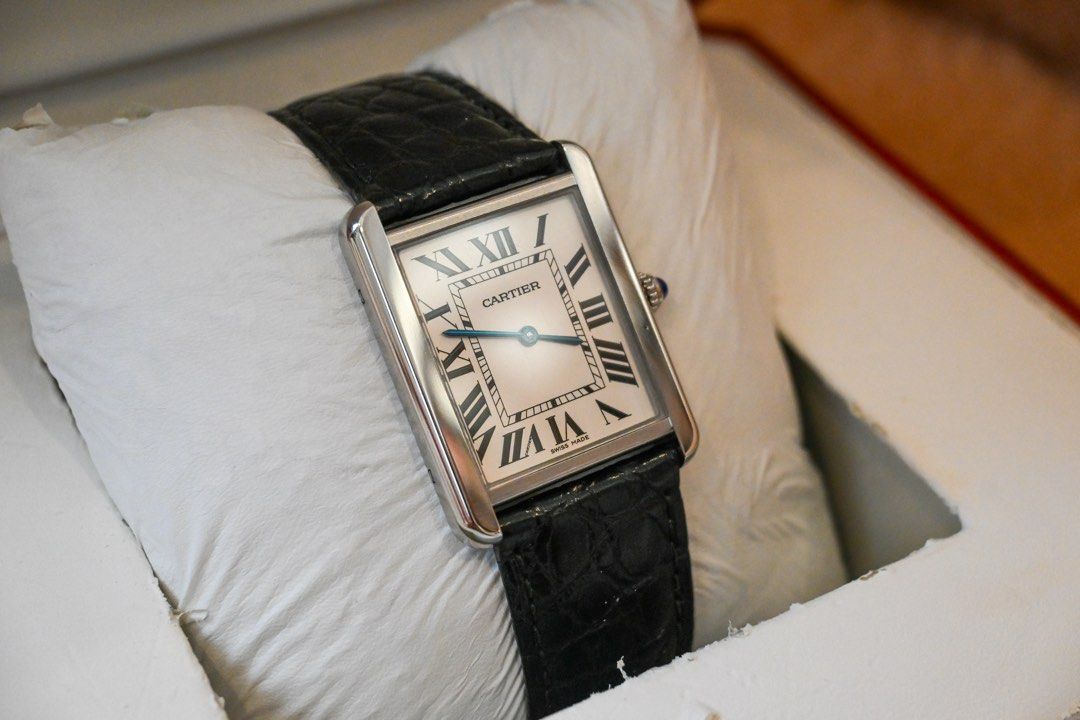 CARTIER TANK SOLO — LARGE (Category: Luxury Watches) located in Santa Rosa. Submitted by fourthhourtimepieces (Listing ID 1469787291, Image 2). Description: CARTIER TANK SOLO — LARGE Classic Roman numerals, blue sword-shaped hands, and a rectangular case paired with a black leather strap. • Year: 2016 • Large size • Silvered Roman-numeral dial • Stainless-steel case • Black leather strap • Blue cabochon crown • Full set Asking Price: ₱179,000 📍 