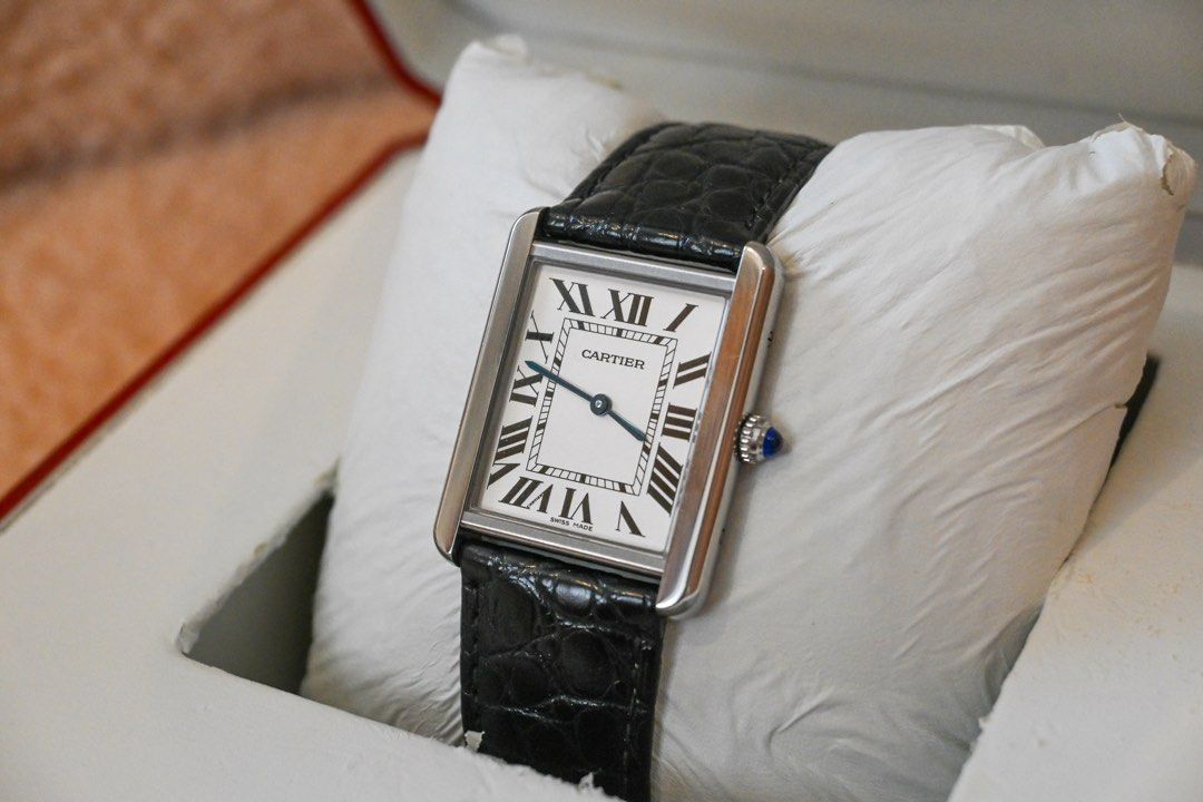 CARTIER TANK SOLO — LARGE (Category: Luxury Watches) located in Santa Rosa. Submitted by fourthhourtimepieces (Listing ID 1469787291, Image 3). Description: CARTIER TANK SOLO — LARGE Classic Roman numerals, blue sword-shaped hands, and a rectangular case paired with a black leather strap. • Year: 2016 • Large size • Silvered Roman-numeral dial • Stainless-steel case • Black leather strap • Blue cabochon crown • Full set Asking Price: ₱179,000 📍 