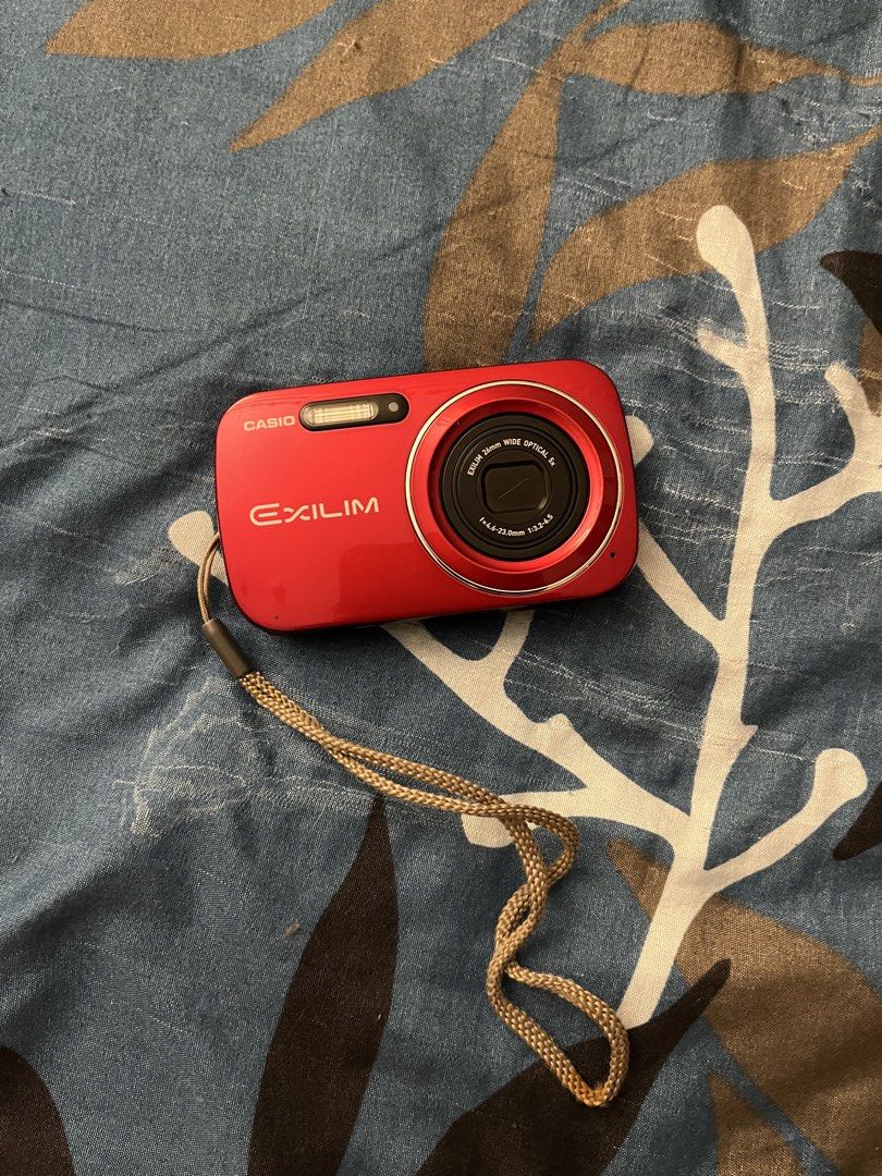 Casio Exilim EX-N1 (Category: Cameras) located in Quezon City. Submitted by live_louisee (Listing ID 1469922621, Image 1). Description: - Model: Casio Exilim Compact Digital Camera - Color: Vibrant Red - Condition: Tested and 100% working properly - Features: Powers on, clear screen, takes high-resolution photos, includes wrist strap - Perfect for: Casual everyday snaps and aesthetic vintage-style digital photography - Size: Pocket-friendly and e